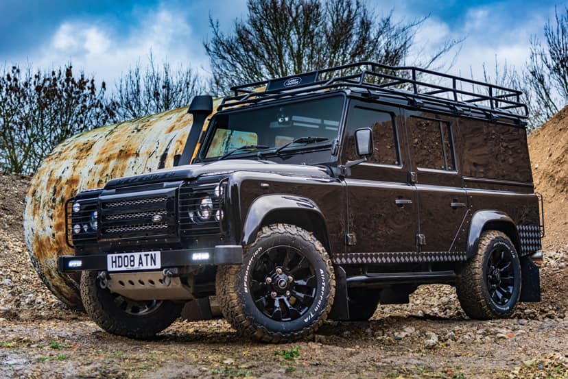 Image of a Black Land Rover Defender 100 Utility