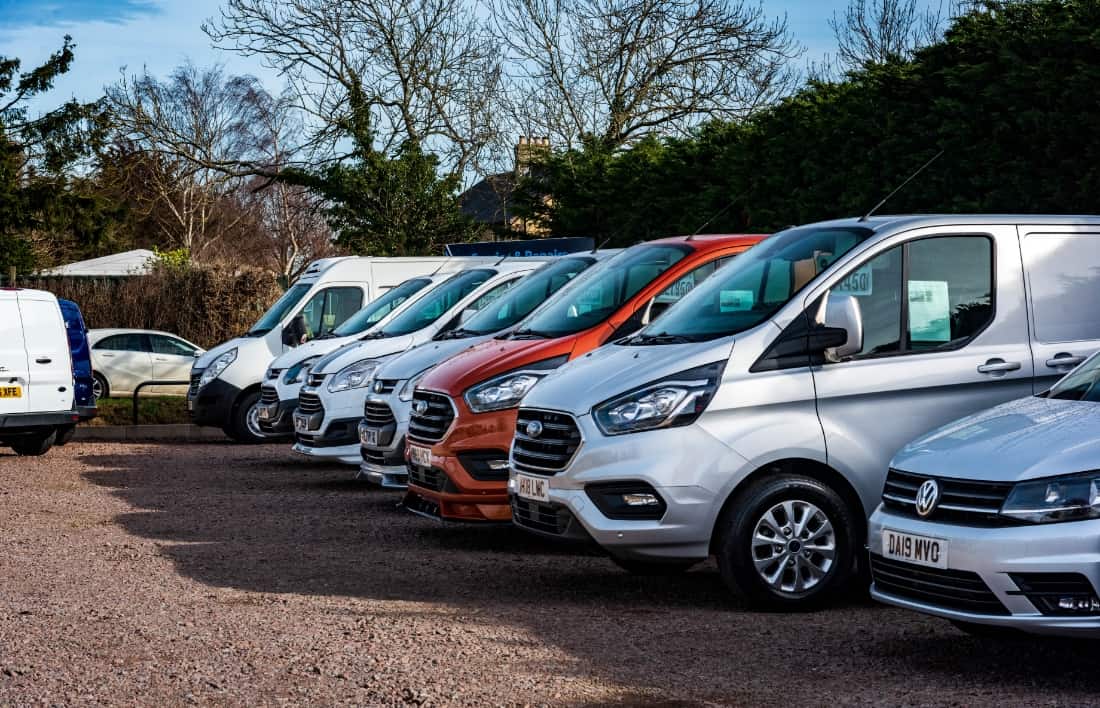 An image of multiple vans and cars in the Wallis Rentals fleet
